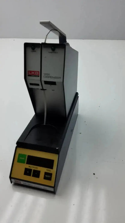 Lkb Wallac 1291 reagent dispenser in black and yellow with digital display for in vitro diagnostic purposes