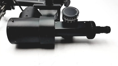 Black metal telescope mount with circular adjustment dial marked merical and engraved scale on lombart instrument keratometer model 12515