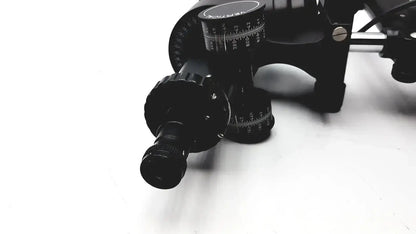 Black metal telescope mount with adjustable knobs and measurement markings on lombart instrument keratometer model 12515