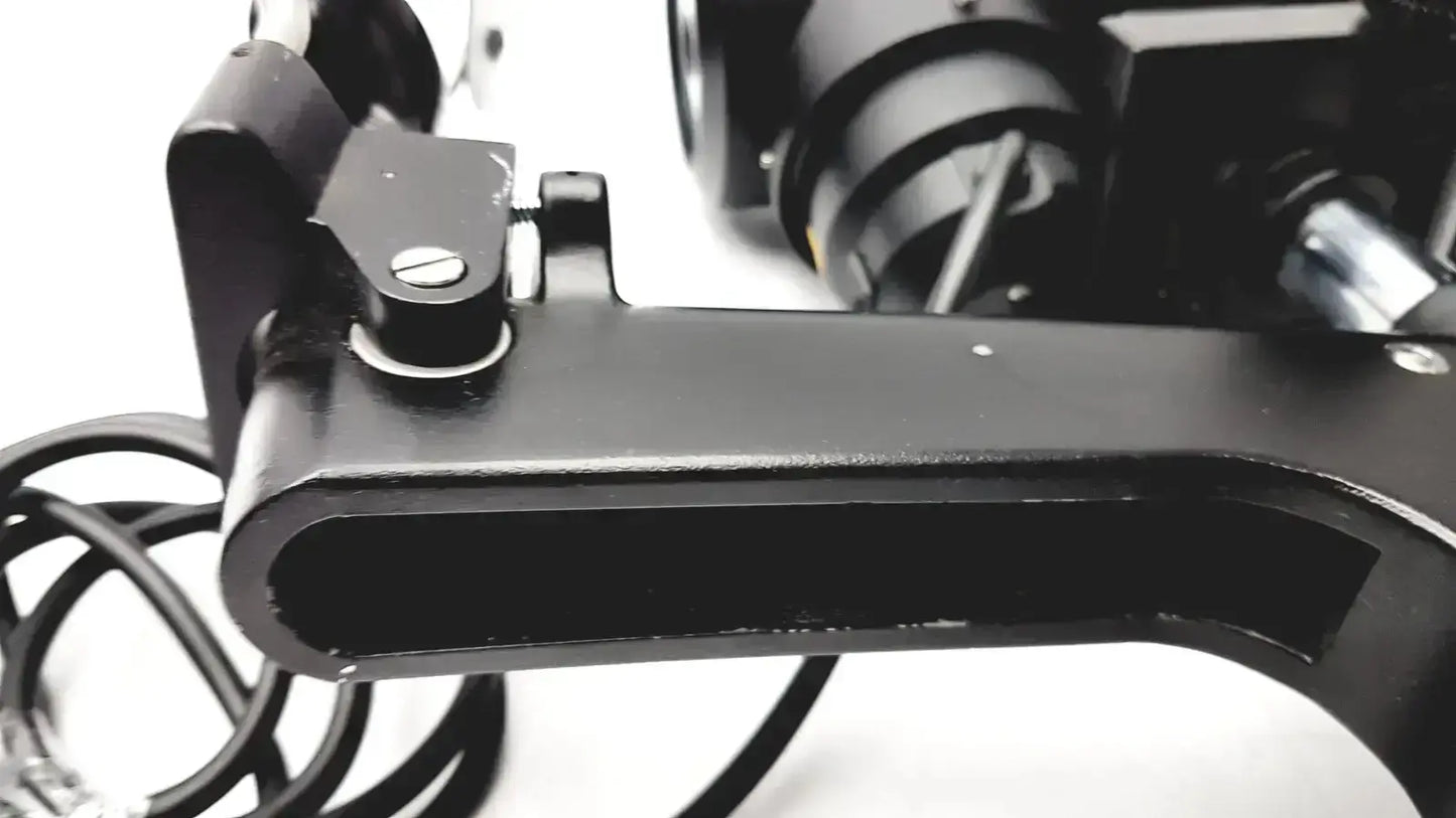 Black metal camera tripod mount with circular adjustment knob and screws on lombart instrument keratometer model 12515