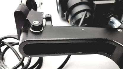 Black metal camera tripod mount with circular adjustment knob and screws on lombart instrument keratometer model 12515