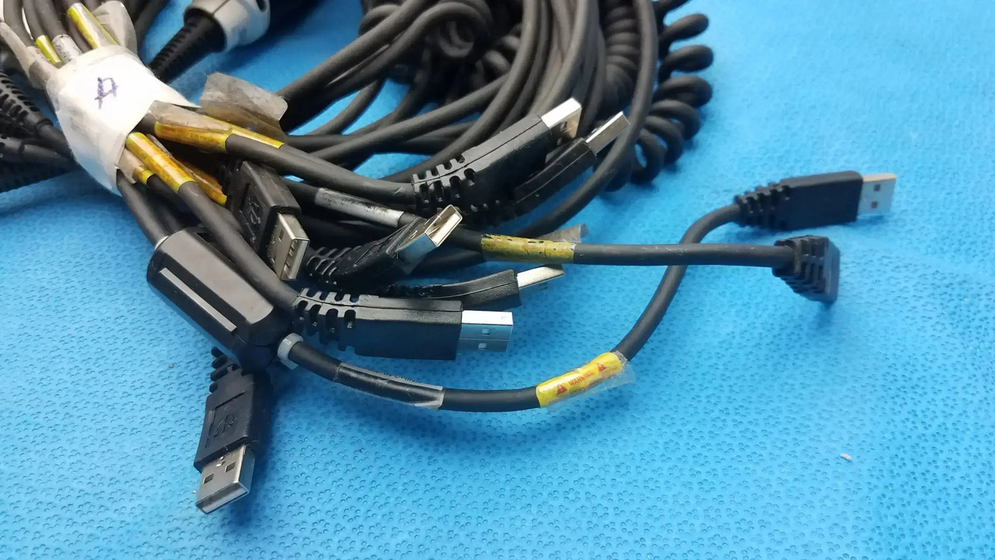 A bundle of black coiled usb cables with yellow tape markings for jadak cbl-0144 handheld barcode scanners