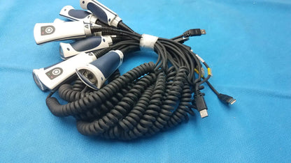 Set of five white and navy blue Jadak CBL-0144 handheld barcode scanners with coiled black cables for medical use