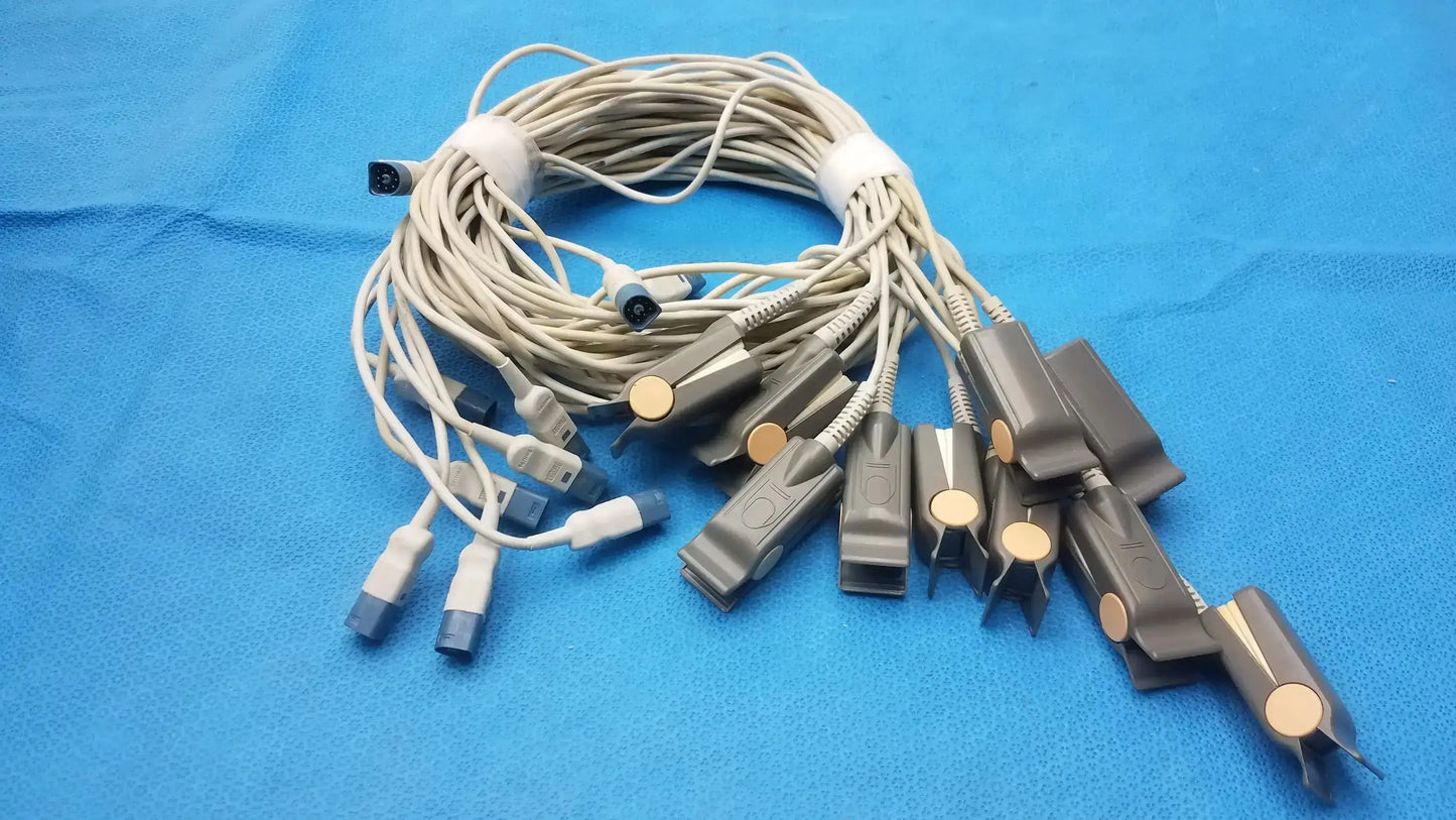A bundle of beige medical ecg lead wires with gray connectors and gold sensors for philips adult finger clip sensor