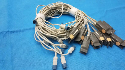 A bundle of beige medical ecg lead wires with gray clamps and blue connectors for adult finger clip sensor use