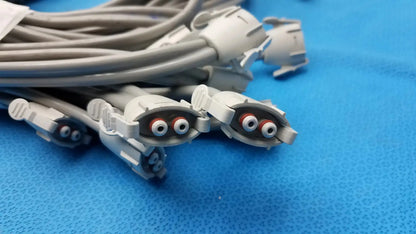 Lot of 12 gray nibp air hose fast connectors with white plastic housing and red and black circular ports for medical use