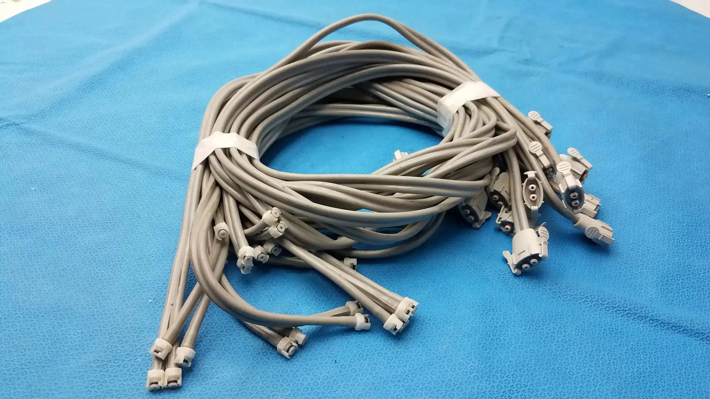 Coiled gray nibp air hose with multiple white plastic air hose fast connectors for double tube use lot of 12
