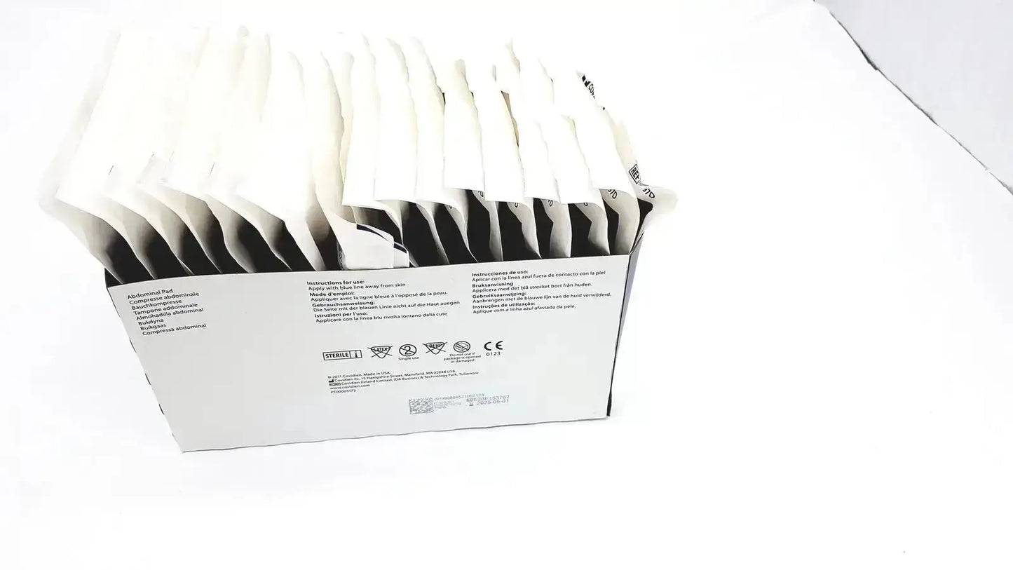 White cardboard box containing covidien dermacea abdominale sterile individually packaged medical gauze pads ref 7197d