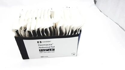 A box of 18 covidien dermacea abdominale pads 7 1/2x8 individually wrapped in black and white packets