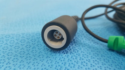 Black cylindrical catheter connector cable with silver inner ring and gold pins for reuse medical equipment use