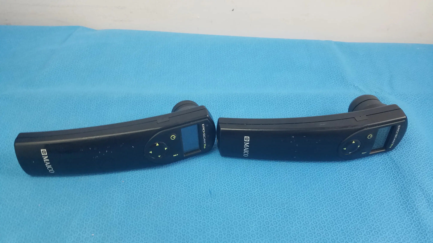Lot of 2 black d-maco handheld auditory remote controls with digital displays and directional buttons for hearing screening