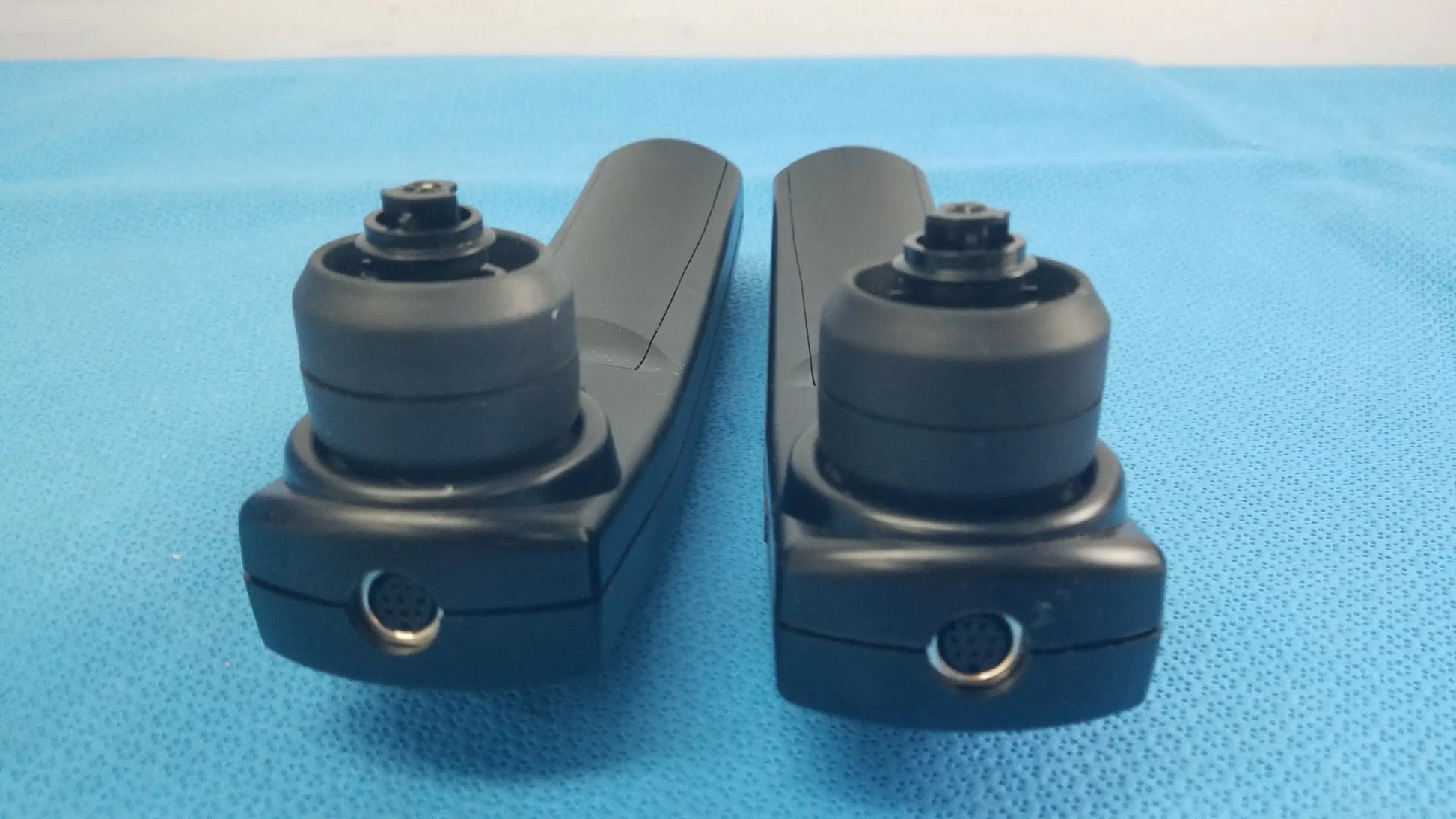 Lot of 2 Maico Ero Scan Pro handheld auditory scanners with black plastic surgical retractors and rounded handles for hearing screening medical equipment