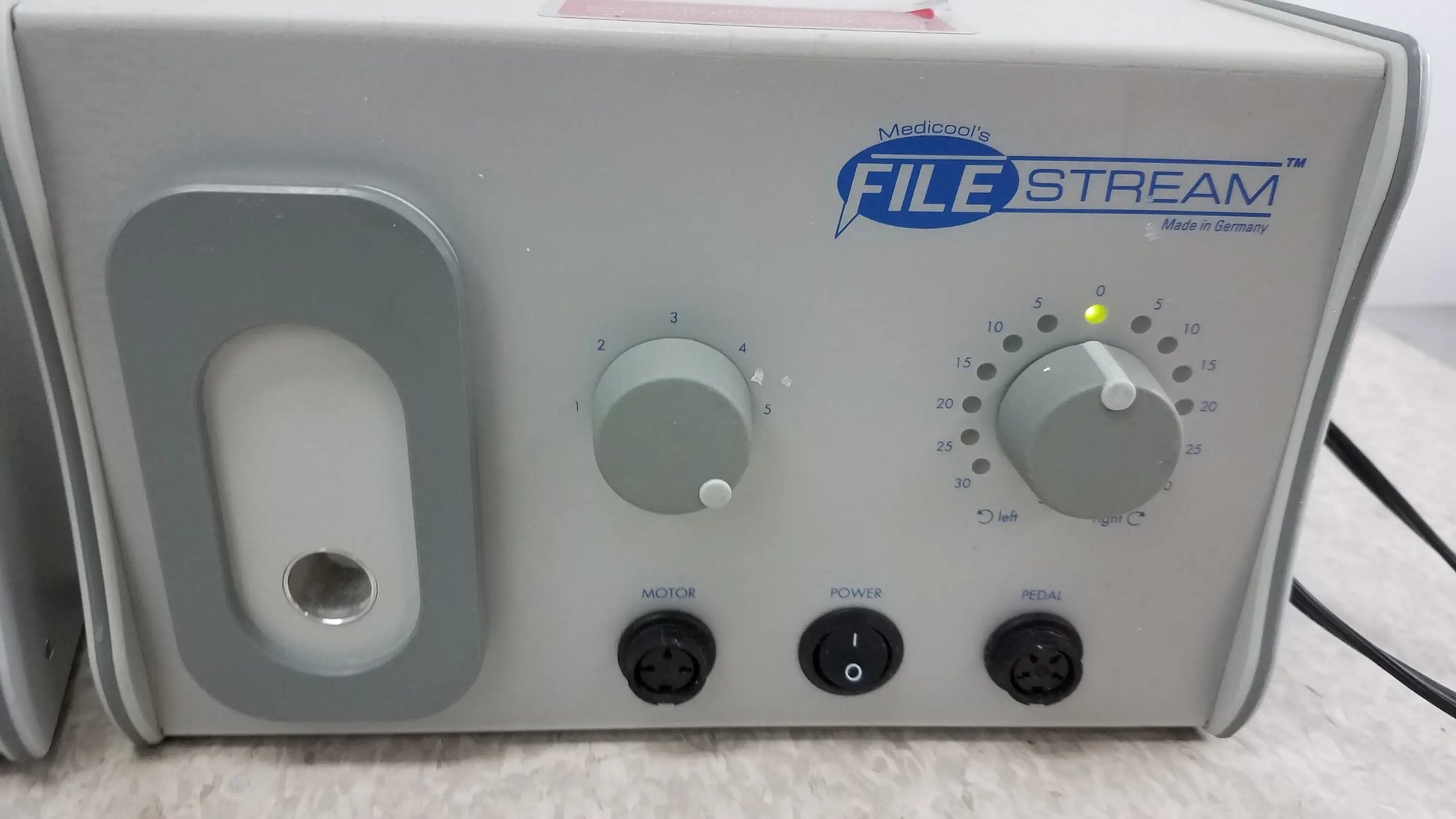 Gray medico file stream ii podiatry drill control unit with two gray knobs and black power ports back side reuse medical equipment