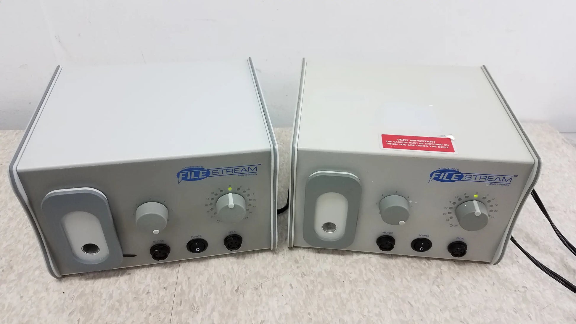 Two gray Medicool 1811 File Stream II podiatry drills with control knobs and ports for reuse medical equipment