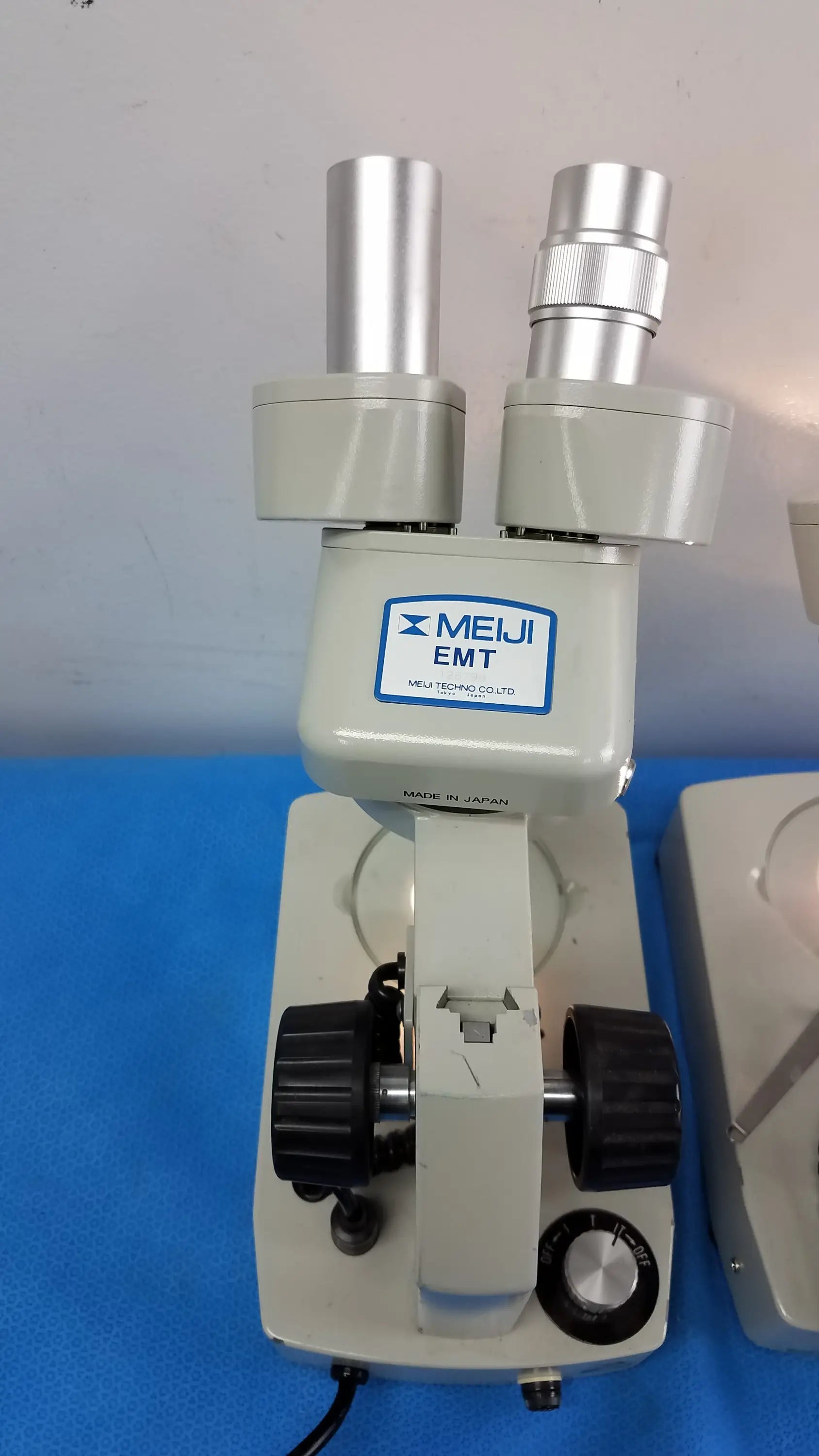 Lot of 2 meiji techno emt-1 stereo microscopes with dual eyepieces gray body medical equipment for detailed observation
