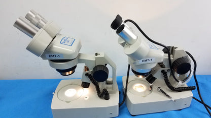Lot of 2 meiji techno emt-1 white stereo microscopes with silver eyepieces black knobs and built-in light source medical equipment