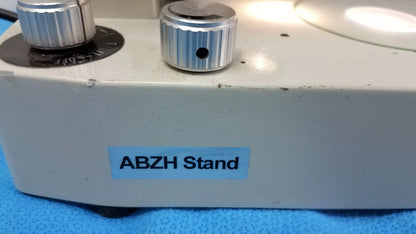 White abzh stand with two silver ribbed knobs for precise adjustment in Meiji Techno EMT-1 stereo microscope medical equipment