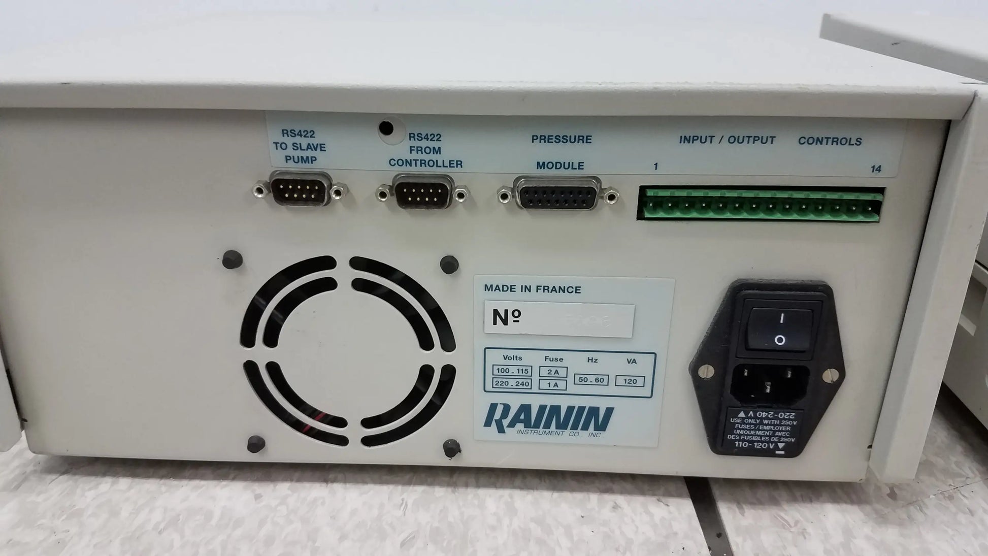 Beige rainin hpXL solvent delivery system control unit with black grille and rs422 ports for buy used medical equipment