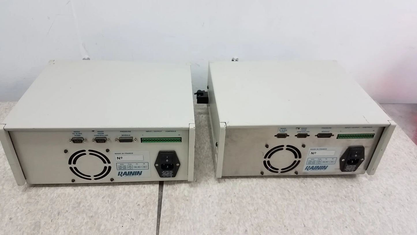 Two beige rainin hp xl solvent delivery systems showing back with ventilation grilles and ports for buy used medical equipment