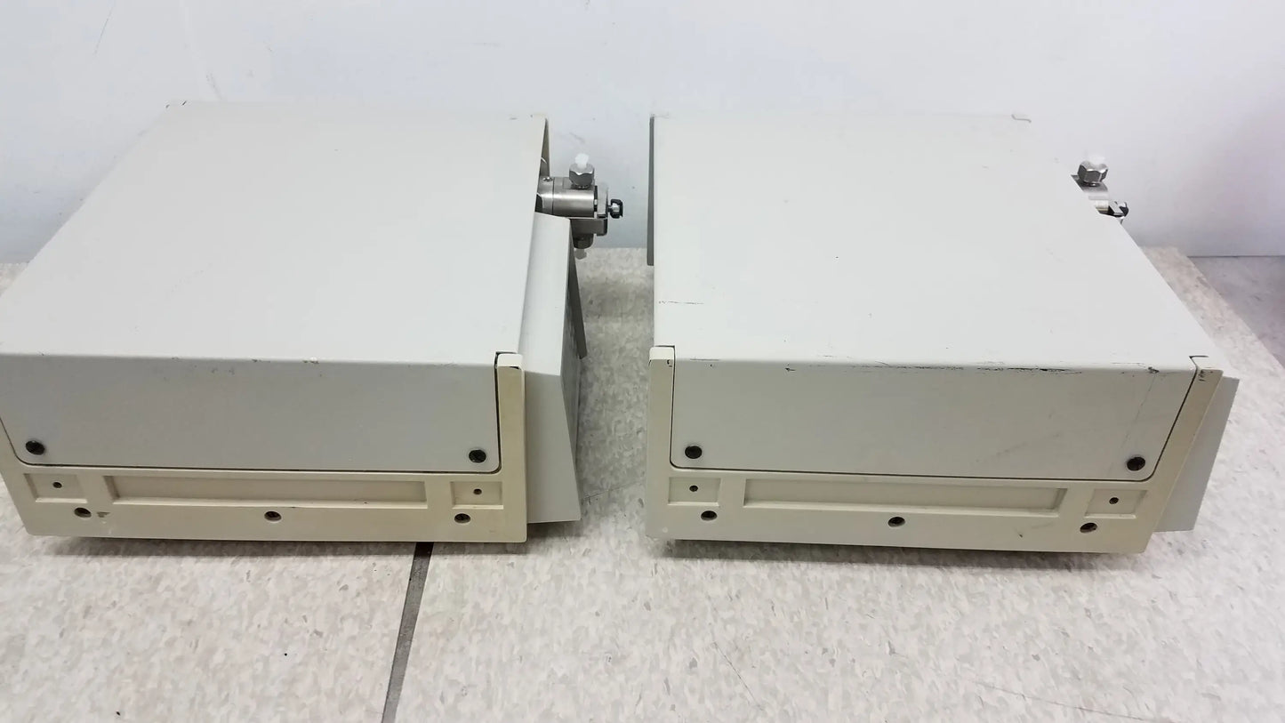 Two beige rectangular metal industrial enclosures with fittings from lot of 2 rainin HPXL solvent delivery system for buy used medical equipment