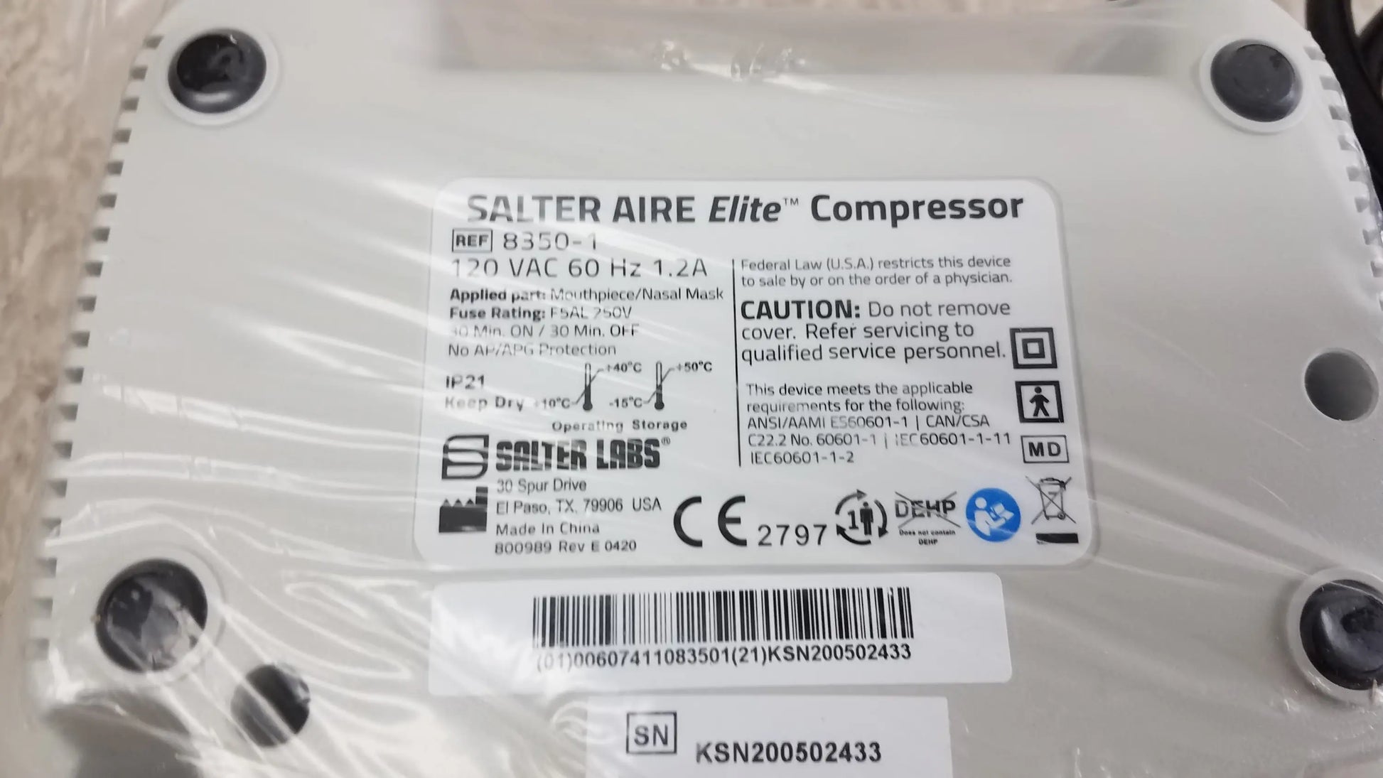 White plastic Salter AIRE Elite compressor with black screw holes and label showing specs for pre owned medical equipment sale