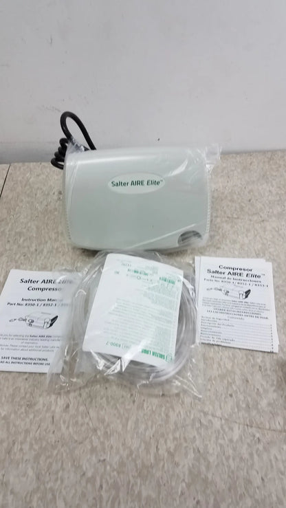Light gray salter aire elite air compressor with black power cord and plastic packaging for buy used medical equipment