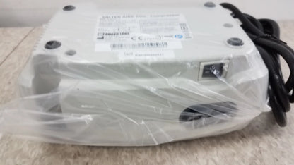 White plastic-wrapped Salter AIRE Elite Compressor Nebulizer System with black power cord for buy used medical equipment