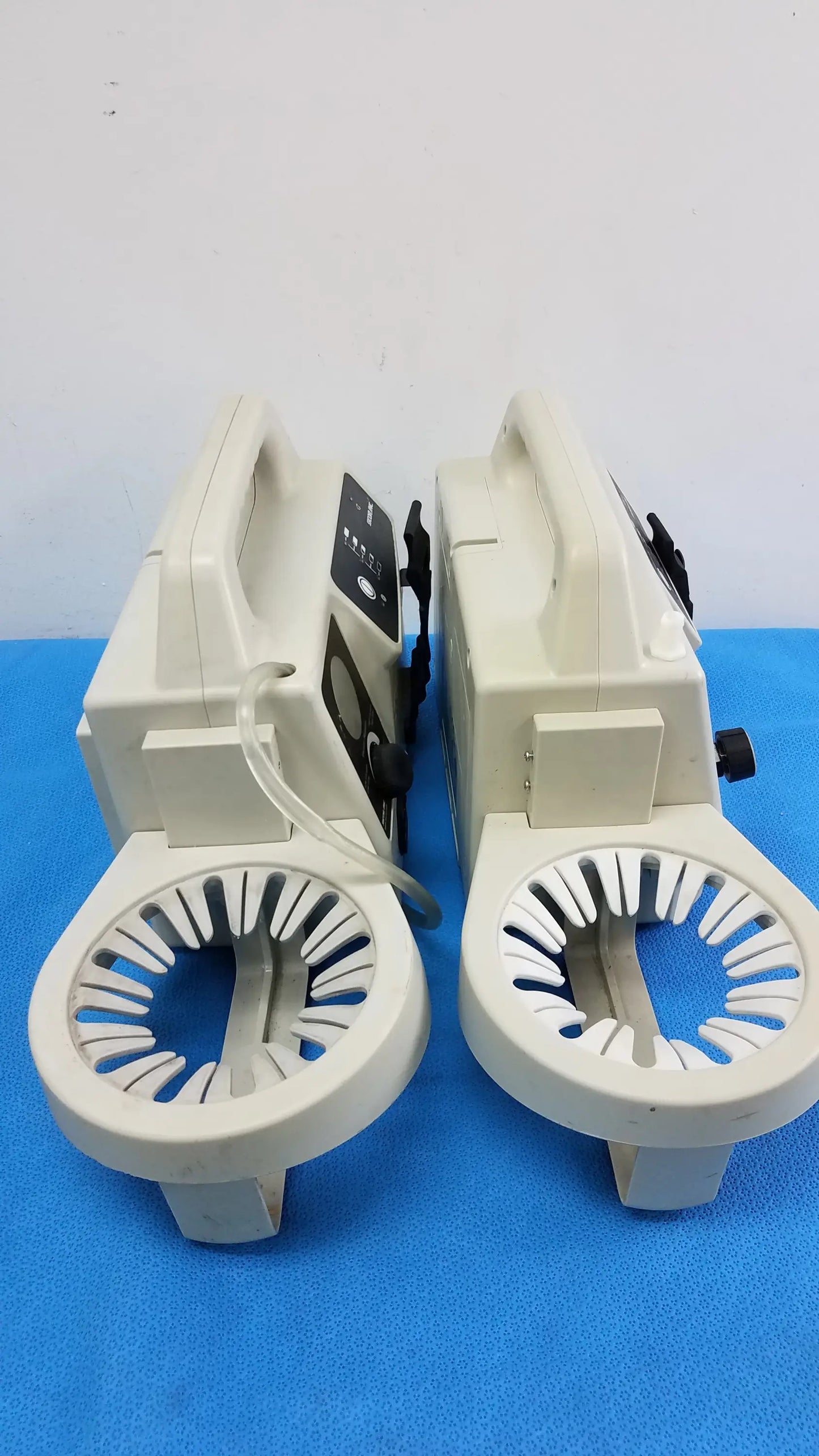 Lot of 2 beige sscor 2314 duet portable aspirators with circular slotted bases and control panels medical equipment