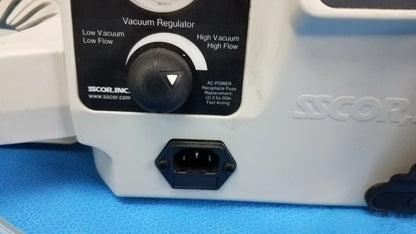 White plastic vacuum regulator with black dial and power plug for sscor duet portable aspirator medical equipment