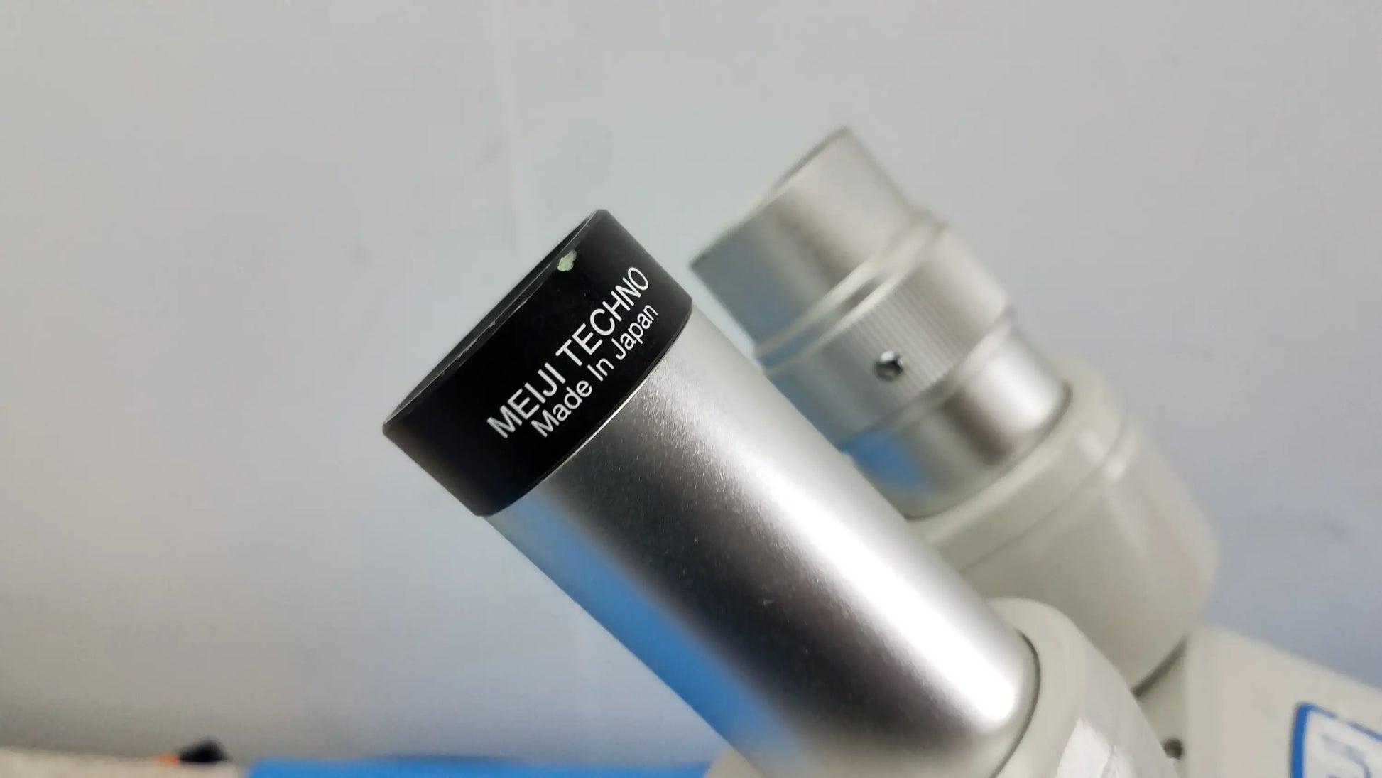 Silver metallic eyepiece with black ring labeled meiji techno made in japan for stereo inverted binocular microscope lot of 2