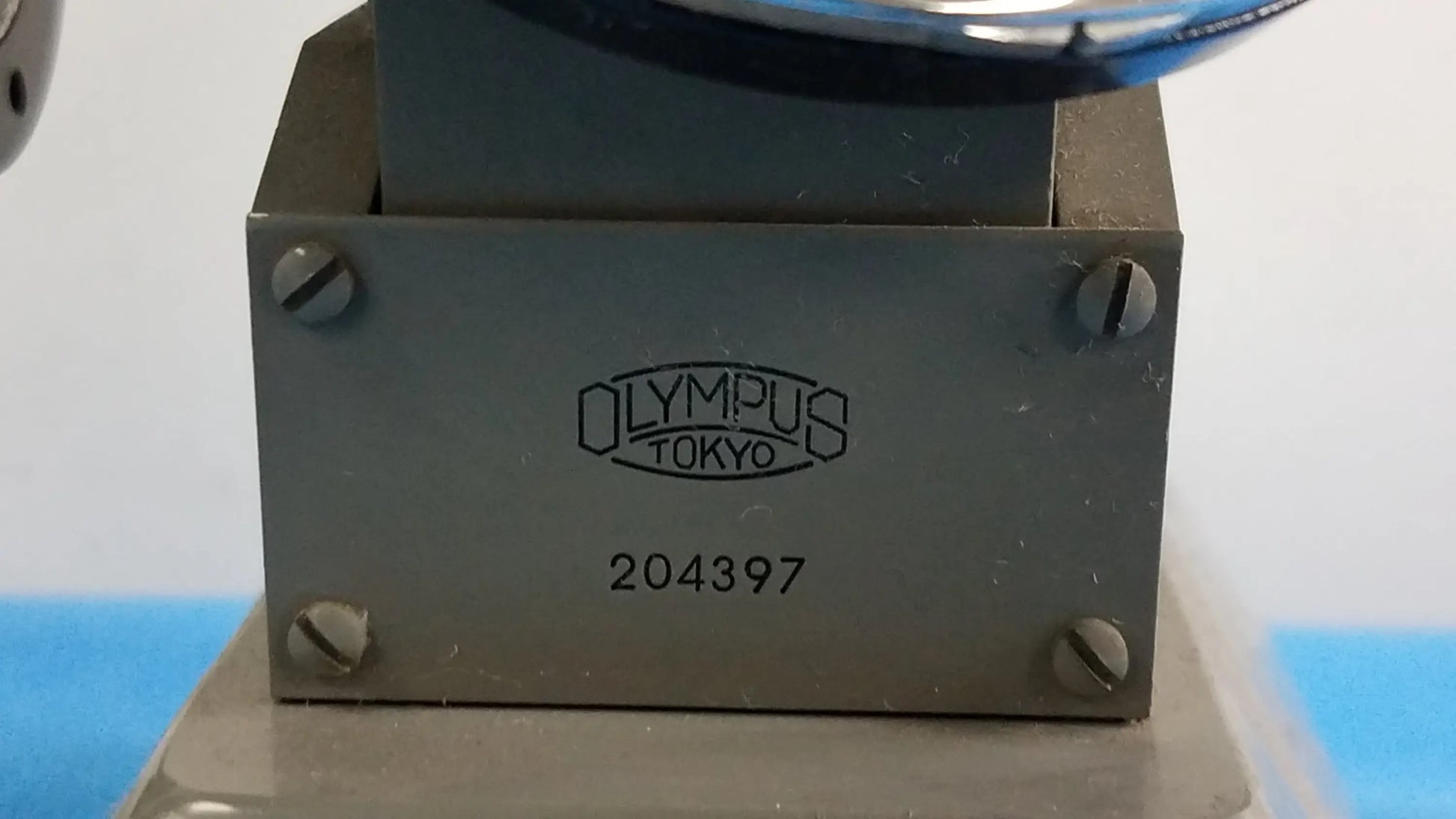 Gray metal olympus tokyo camera base with engraved logo and serial number for stereo microscope and inverted binocular microscope