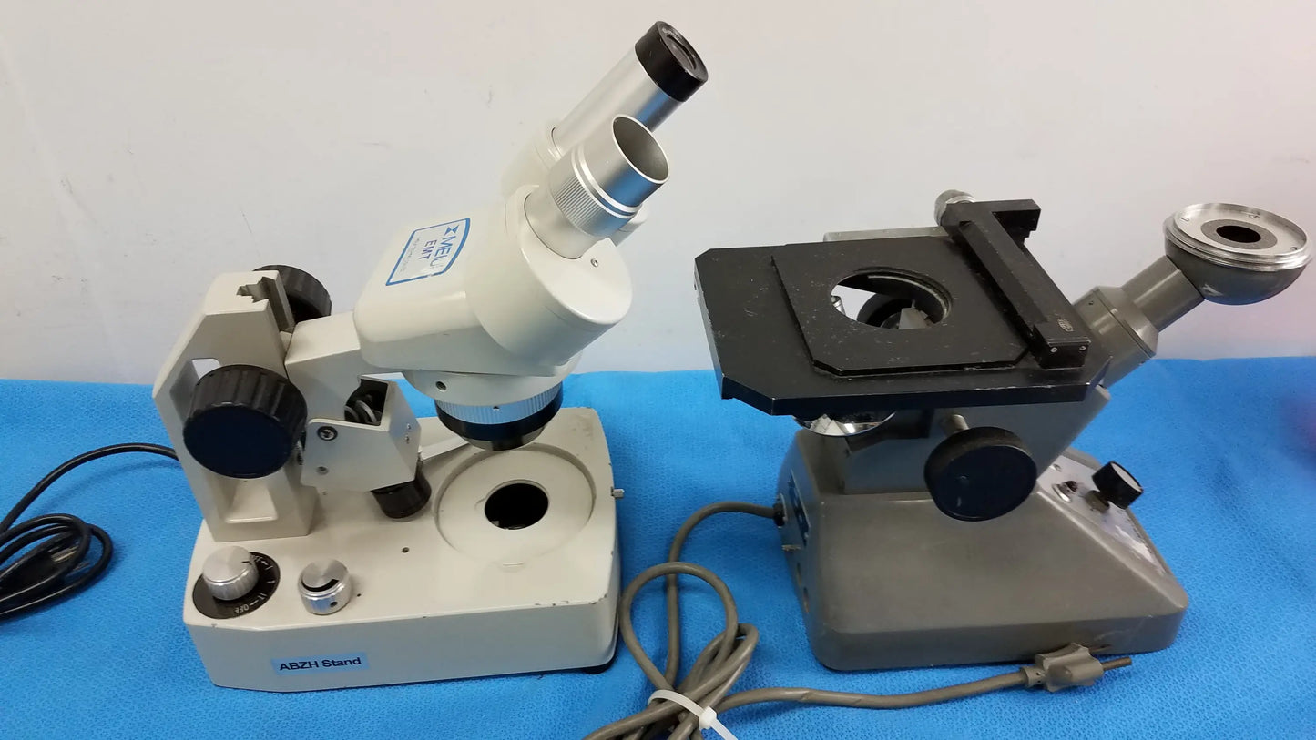Lot of 2 stereo microscope with white and gray inverted binocular microscope featuring dual eyepieces and labeled abzi stand base