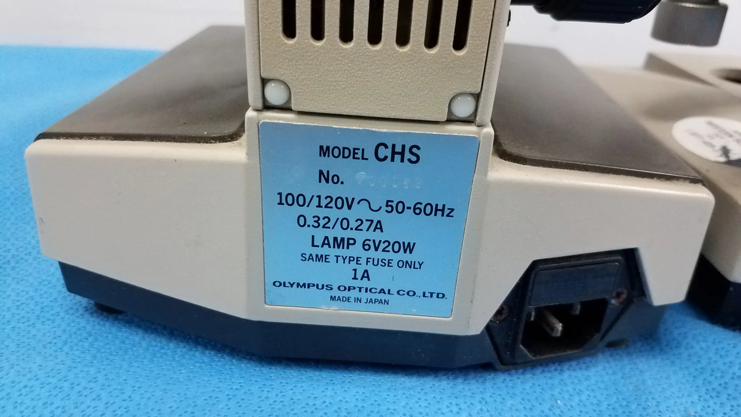 Beige and black olympus chs microscope base with blue electrical label shown from the back in reuse medical equipment lot