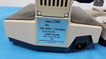 Beige and black olympus chs microscope base with blue electrical label shown from the back in reuse medical equipment lot