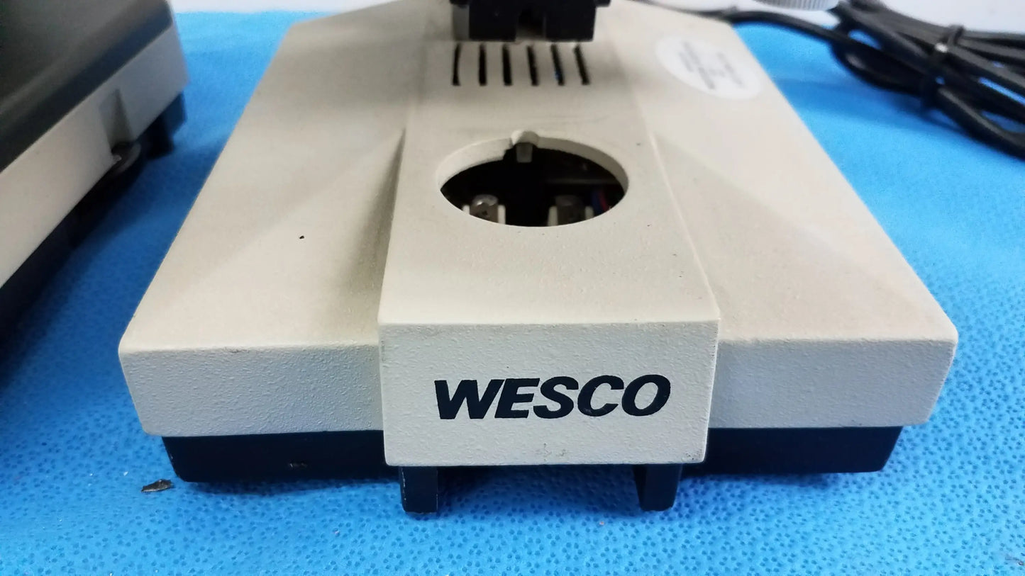 Beige and black wesco electronic device with circular opening on top in lot of 2 wesco and olymus ch 2 laboratory microscopes for reuse medical equipment