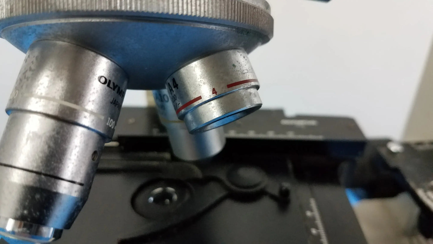 Silver and blue olympus microscope objective lenses with engraved markings for reuse medical equipment in laboratory use