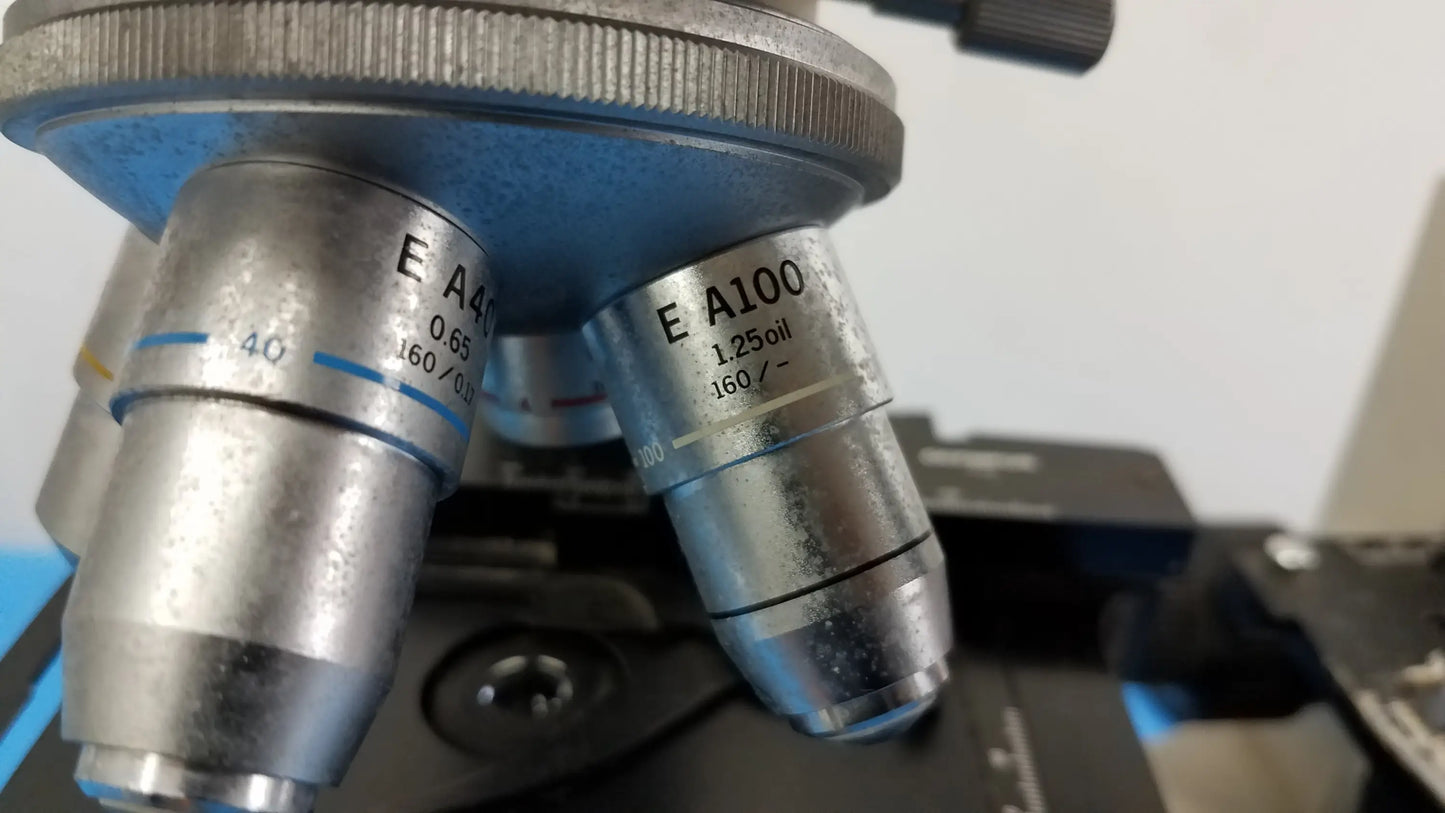 Silver metallic microscope objective lenses with magnification and oil immersion markings for reuse medical equipment