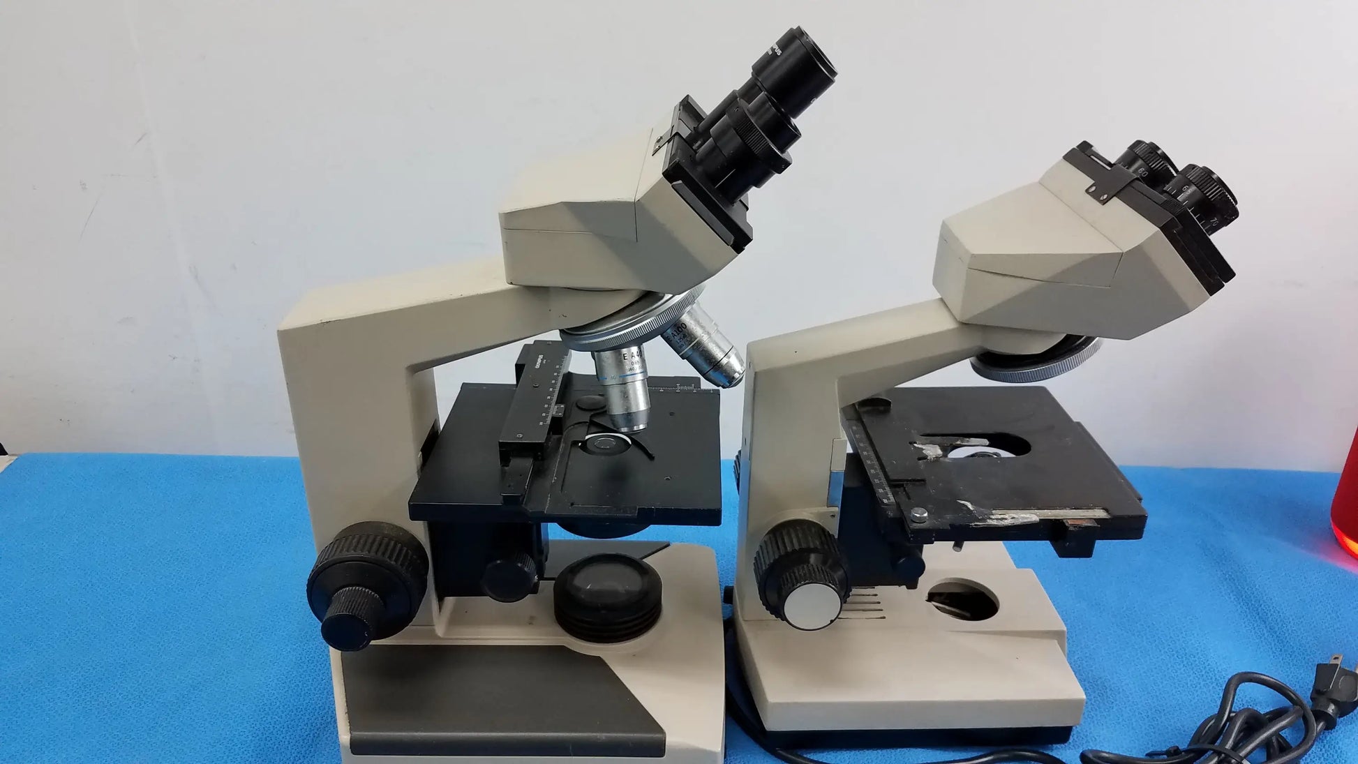Lot of 2 Wesco and Olympus CH-2 beige and black compound microscopes with dual eyepieces for reuse medical equipment