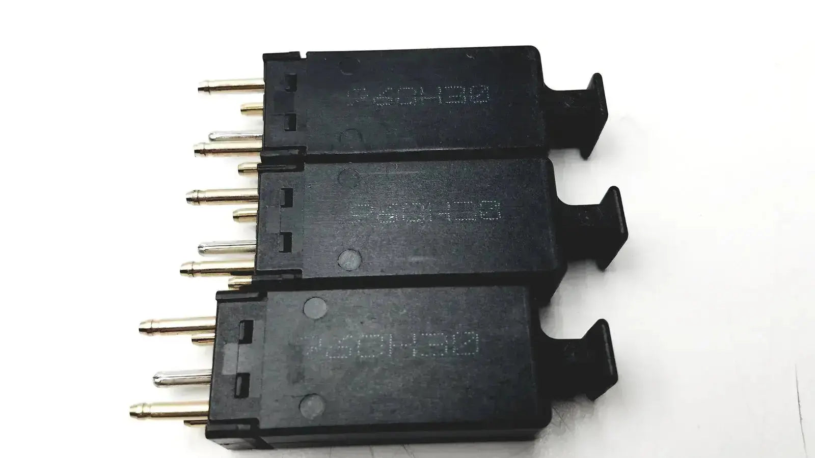 Lot of 3 black plastic 5 pin solid state protector modules with metallic pins and molded lever tabs