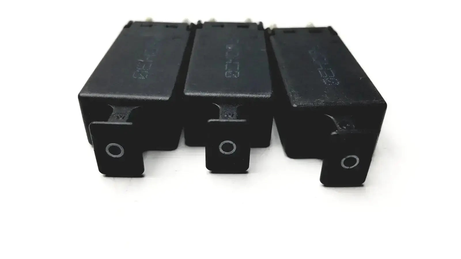 Lot of 3 black rectangular 5 pin solid state protector modules with silver circular accents for automotive use