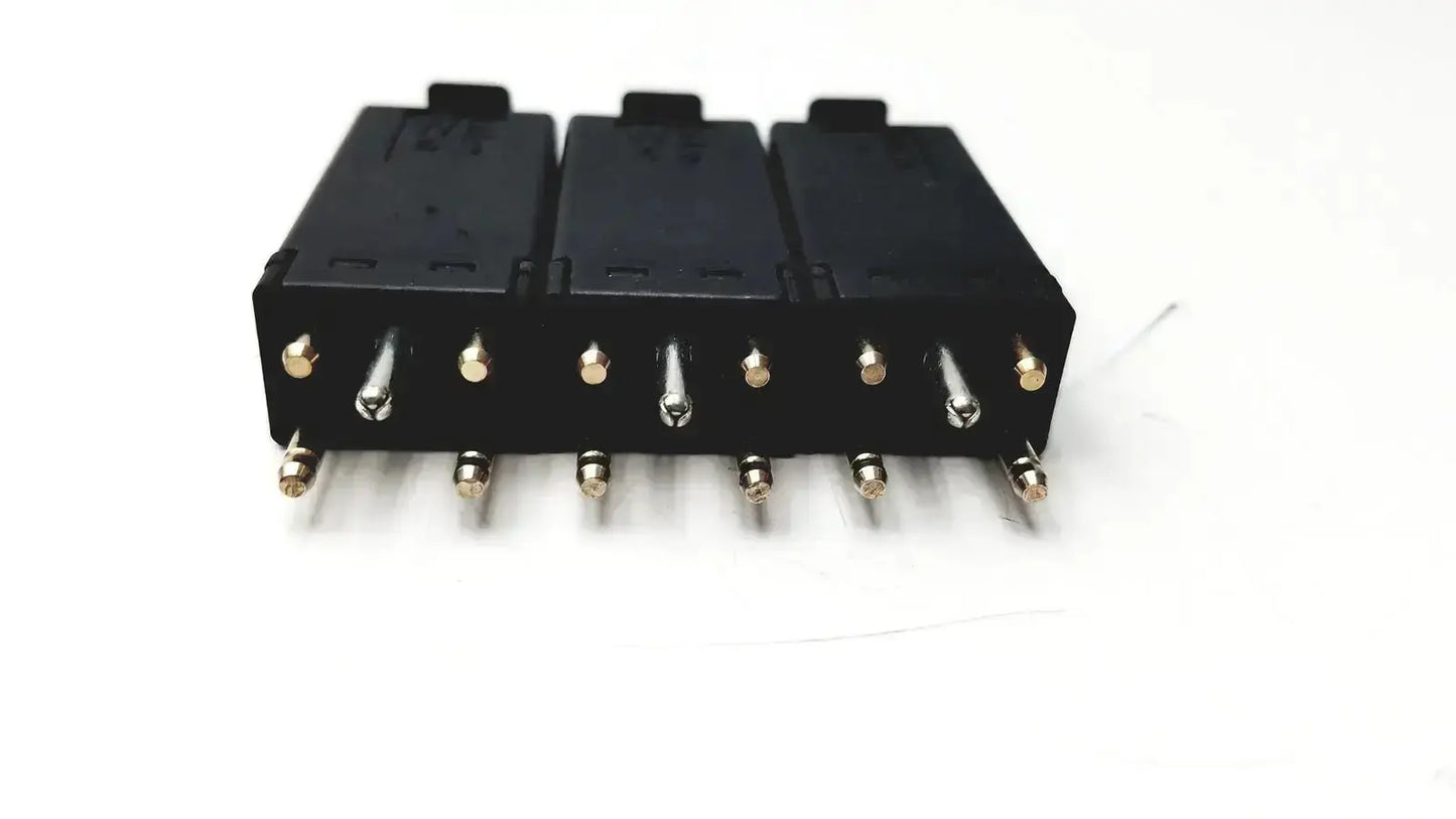 Lot of 3 black plastic 5 pin solid state protector modules with metallic pins and gold-colored terminal caps