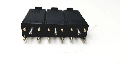 Lot of 3 black plastic 5 pin solid state protector modules with metallic pins and gold-colored terminal caps
