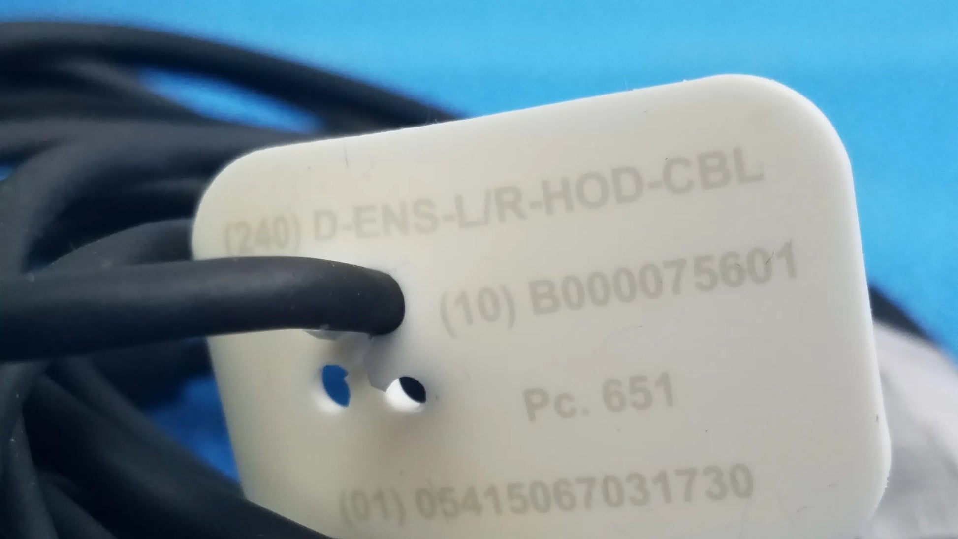 White rectangular plastic tag with embossed alphanumeric codes for reuse medical equipment in ensite x ep system connector cable lot of 3