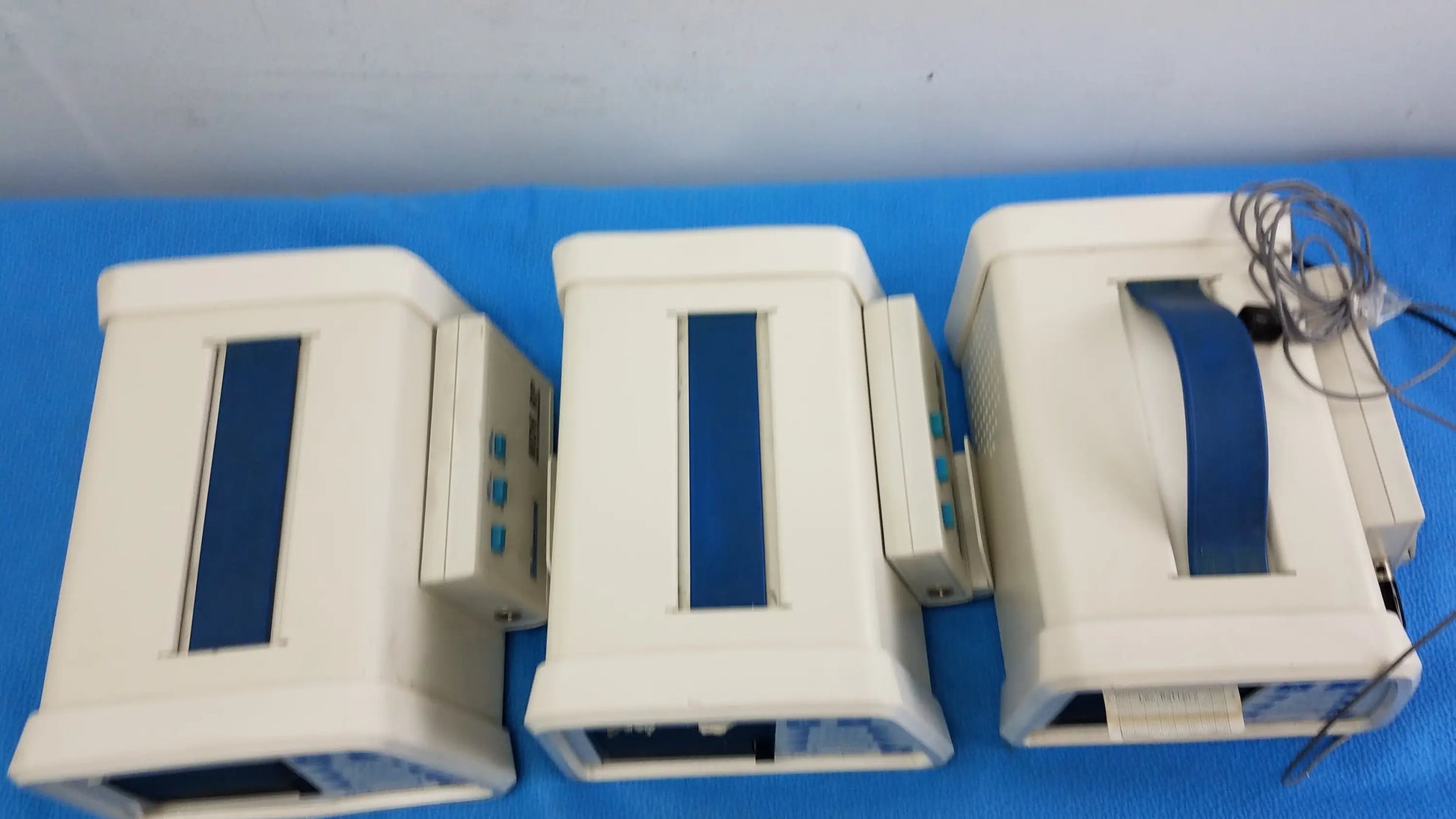Lot of 3 hokanson md6vr chart recorders with white medical equipment monitors and blue vertical panels with cables attached