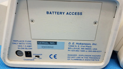 White plastic battery access panel with blue text and serial label on the back of hokanson md6vr chart recorder medical equipment