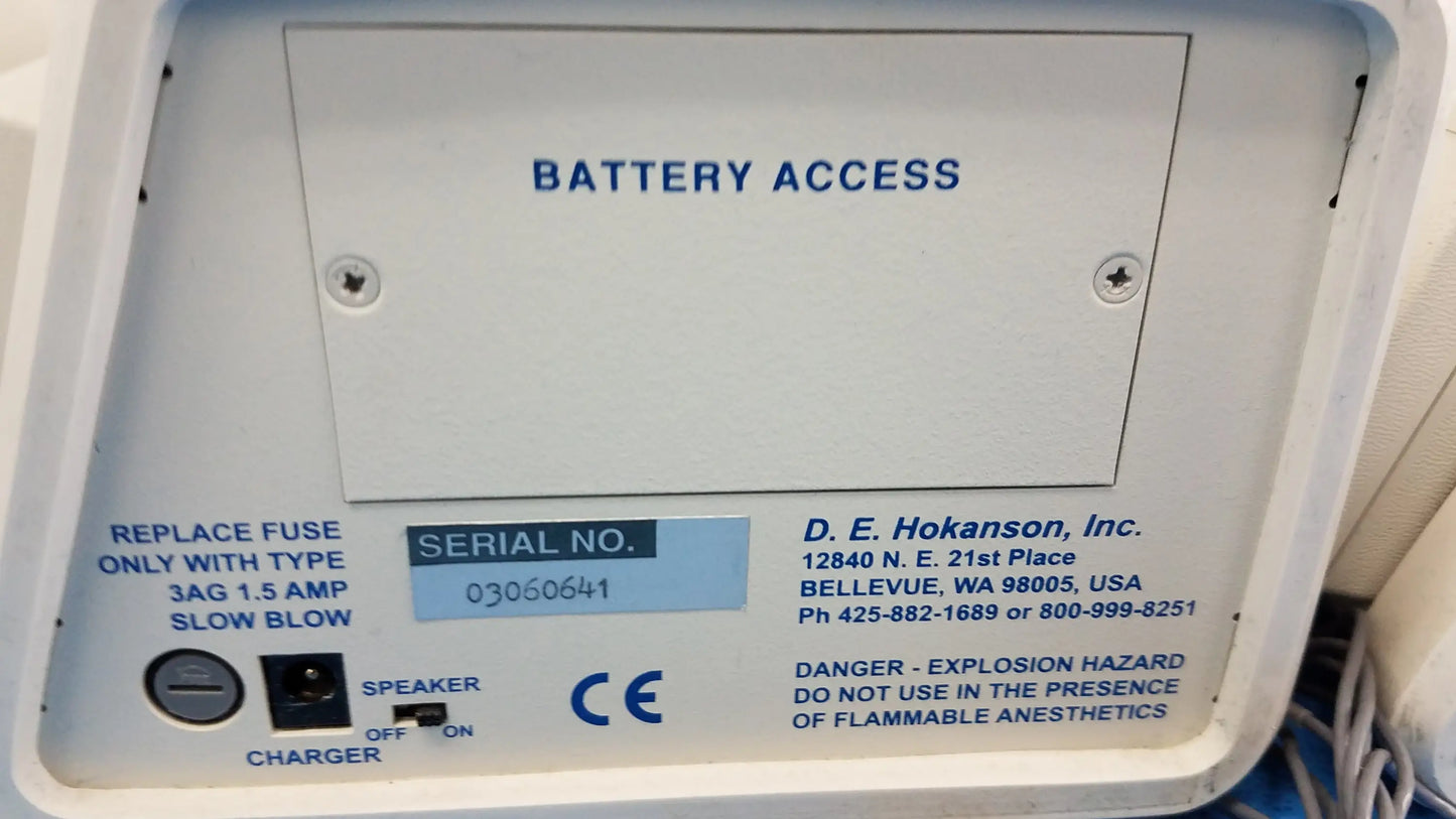 White plastic battery access panel with blue text and serial number label on back of hokanson md6vr chart recorder medical equipment