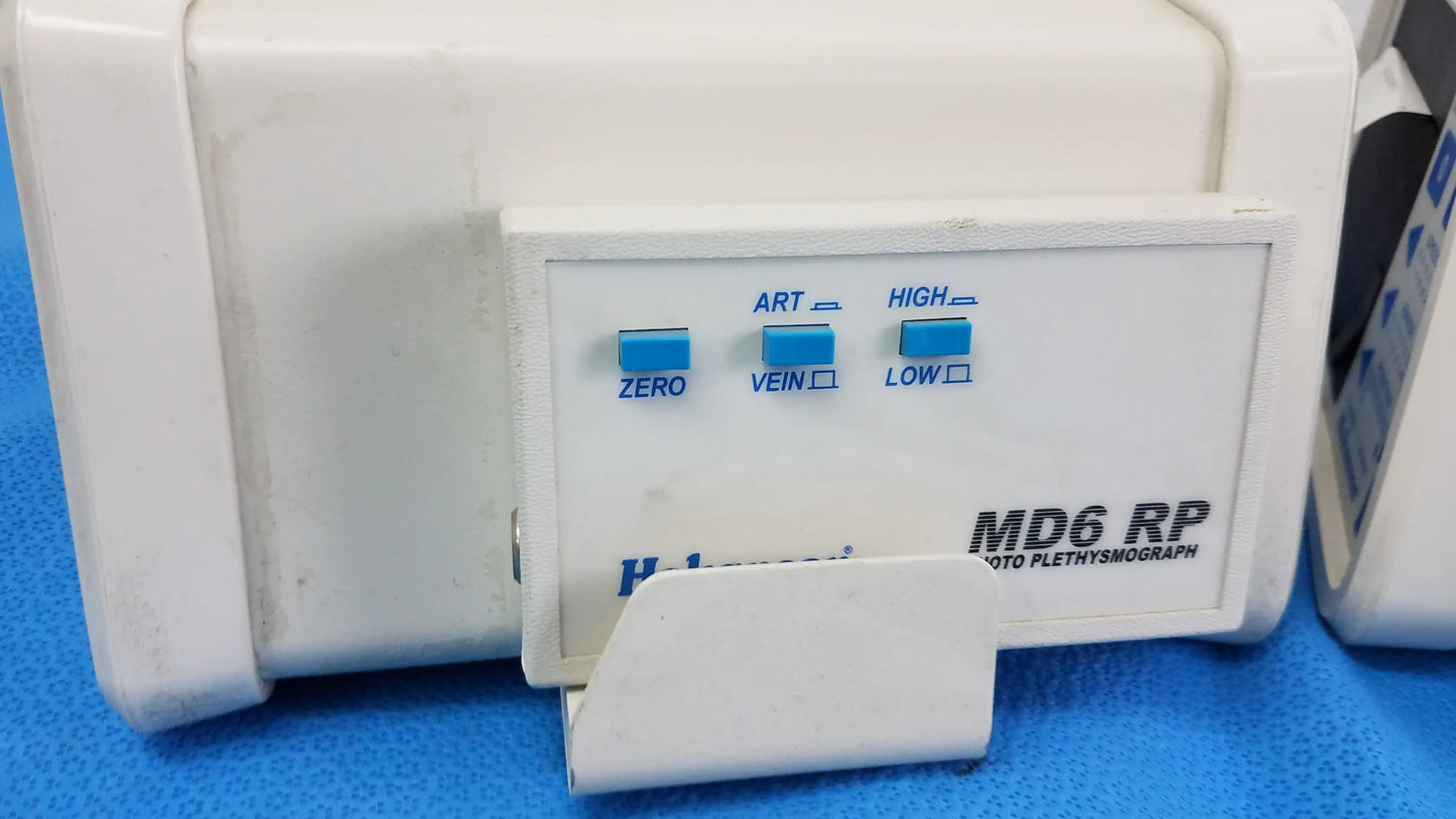 White plastic medical equipment hokanson md6vr chart recorder with blue-labeled control buttons for plethysmograph functions