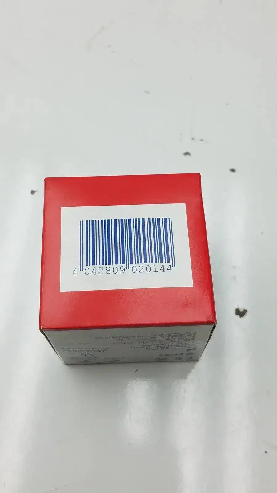 Red rectangular box showing the back side label with barcode for lot of 3 leukoplast cover-roll stretch 2 inch x 2 yards