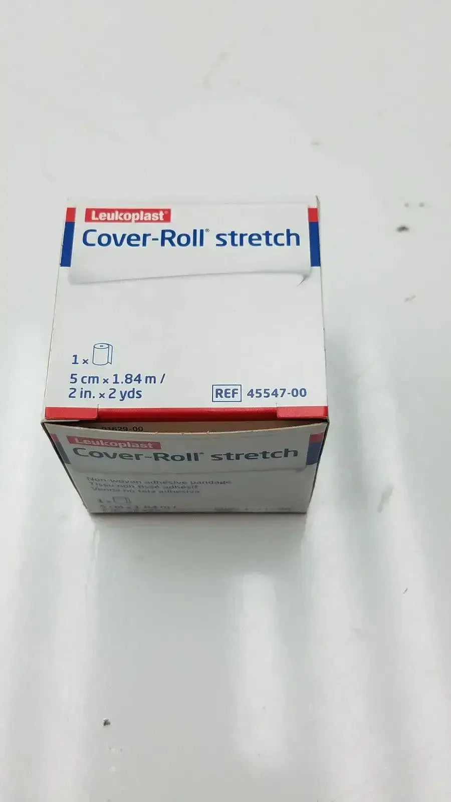 White cardboard box of leukoplast cover-roll stretch bandage with red and blue branding for pre owned medical equipment