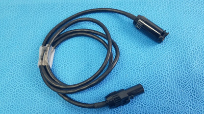 Black coiled mc4 solar connector extension cable with two black plastic connectors for reuse medical equipment applications